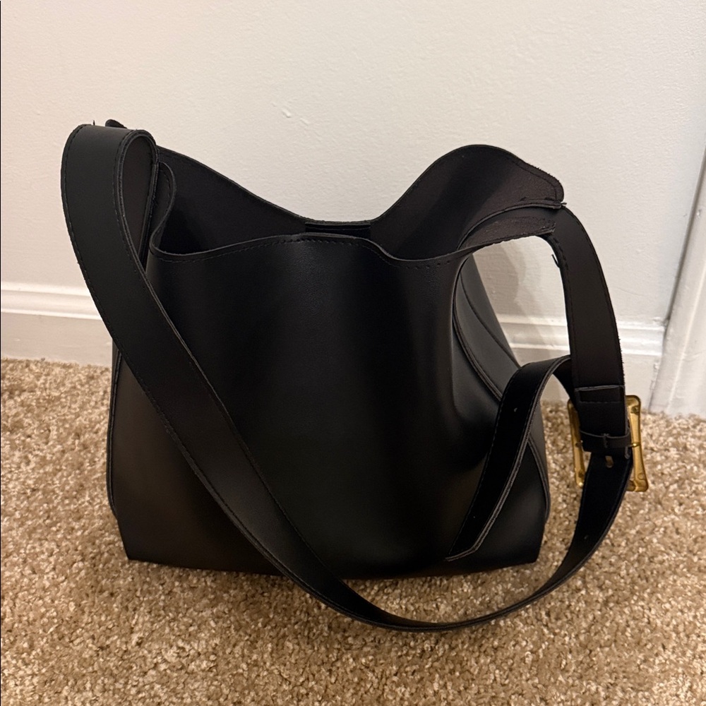 Chic Black Shoulder Bag with a medium cosmetic bag included